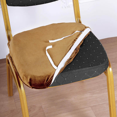 Brown velvet chair cushion with tie straps on a black chair.