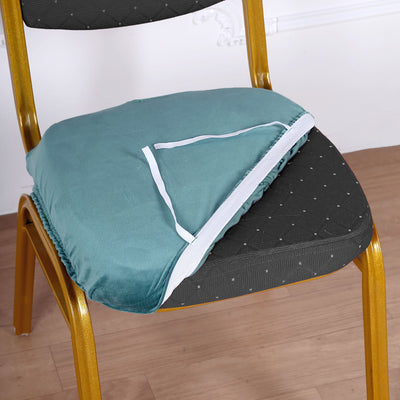 Teal chair cushion with elastic edge on a gold chair.