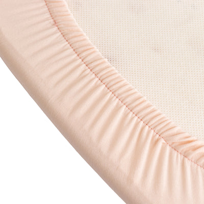 Peach fitted sheet with elastic edges for a snug fit