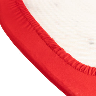 Red elastic edge of a round fabric cover on a white background.