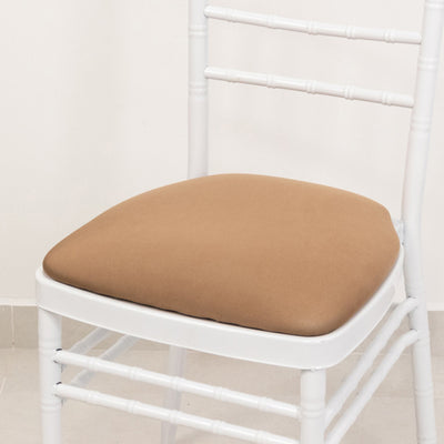 White chair with a brown cushion, minimalist design.