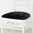 Black velvet chair cushion on a white chair