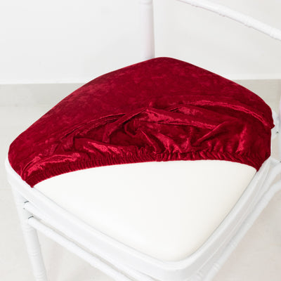 Red velvet chair cover on a white chair