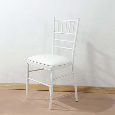 White chiavari chair with a cushioned seat on a plain background.