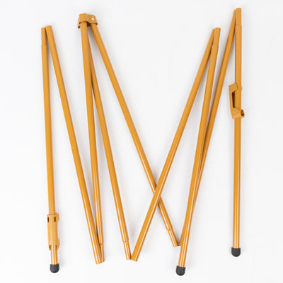 Golden folding tent poles arranged in a star shape on a white background.