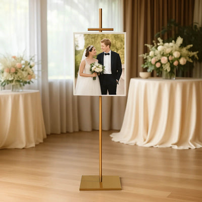 Elegant photo display stand showcasing a wedding picture in a decorated venue.