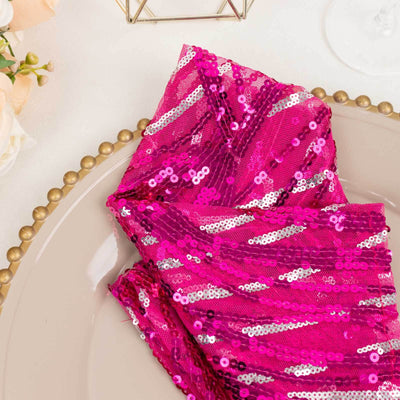 Pink sequin napkin elegantly arranged on a decorative plate.