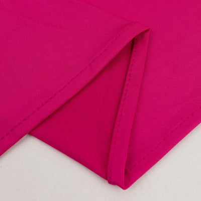 Bright pink fabric with clean edges and stitching details.