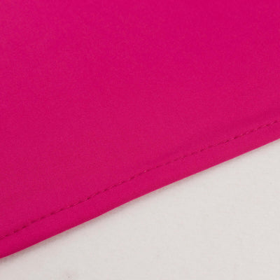 Pink fabric corner with neat stitching detail.