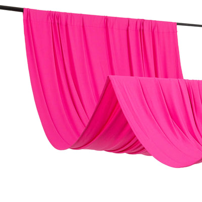 Pink draped fabric on a rod, showcasing elegant folds and texture.