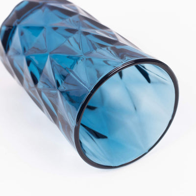 Blue geometric glass vase with a faceted design.