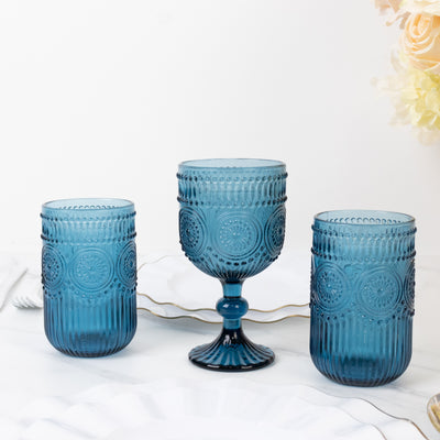 Set of three blue vintage glassware pieces on a white background