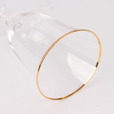 Elegant glass with gold rim, showcasing a refined design.
