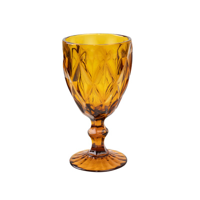 Amber glass goblet with intricate diamond pattern design.