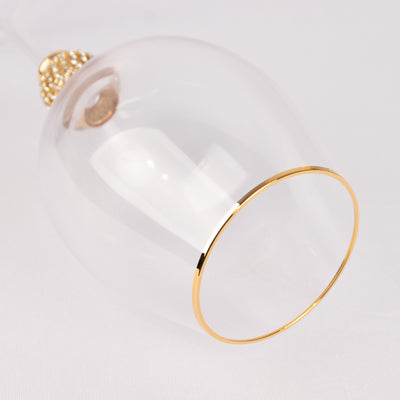 Elegant clear glass with gold trim, perfect for special occasions.