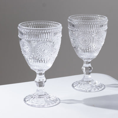 Elegant crystal goblets with intricate designs and a classic shape.