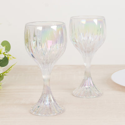 Elegant iridescent wine glasses on a wooden table