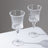 Elegant crystal wine glasses on a minimalistic table.
