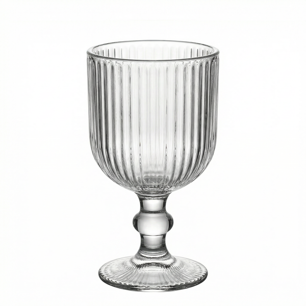 Clear ribbed glass goblet with a decorative base. #whtbkgd