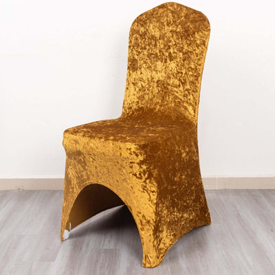 Gold velvet dining chair with unique shape and texture.