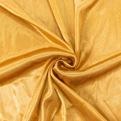 Gold satin fabric with a smooth, shiny texture.