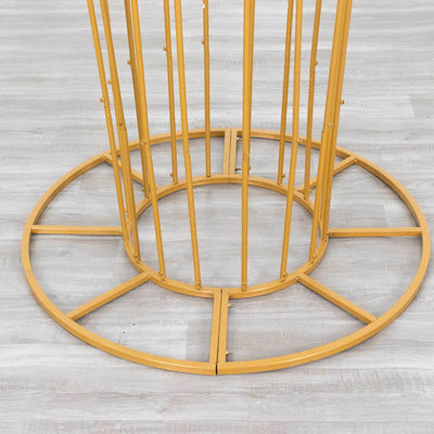 Gold metal plant stand base with circular design and vertical supports.