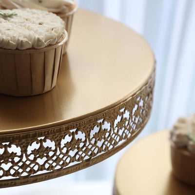 Gold cake stand with decorative edges and cupcakes on top.