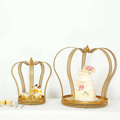 Gold crown-shaped cake stands with a three-tiered cake and desserts