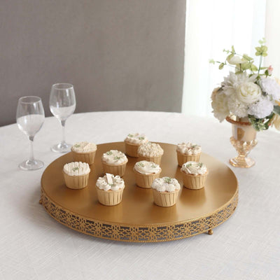 Elegant cupcakes on a gold cake stand with floral decorations.