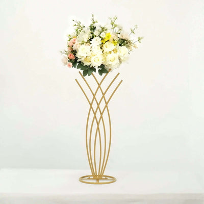 Gold flower stand with white and pink floral arrangement