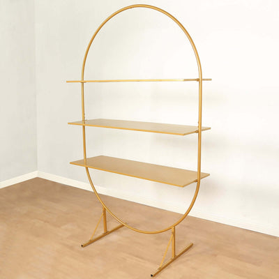 Gold circular shelving unit with three wooden shelves