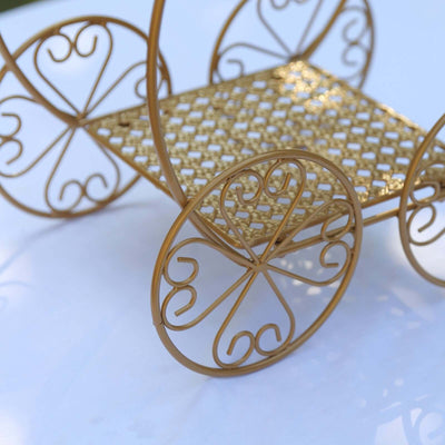 Gold decorative cart with intricate wheel designs