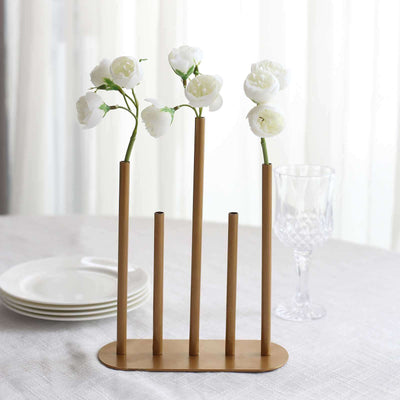 Gold flower vase with white roses, modern design for home decor.