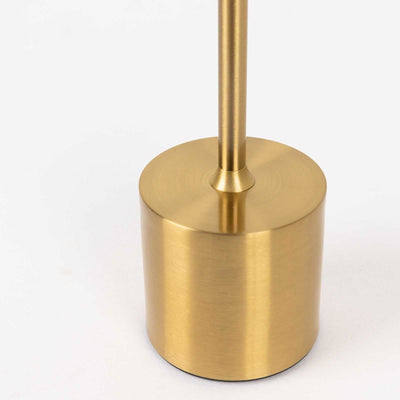Brass lamp base on a white background