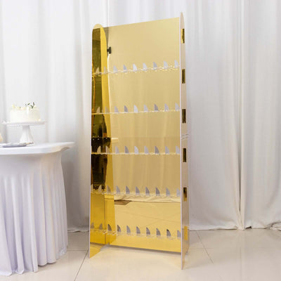 Gold acrylic display stand with multiple shelves for showcasing items.