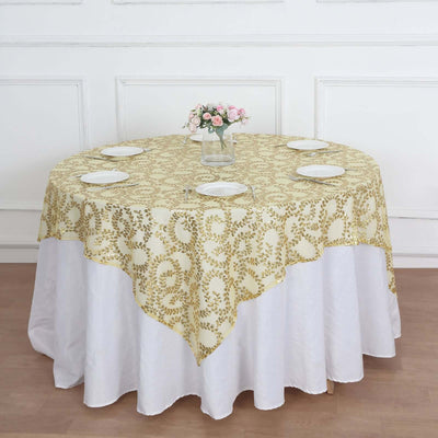 Round table with a gold floral tablecloth and white skirt, set for dining.