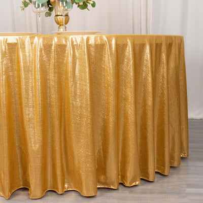 Gold tablecloth with a shimmering texture, elegantly draped over a round table.