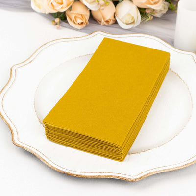 Stack of yellow paper cards on a decorative white plate.