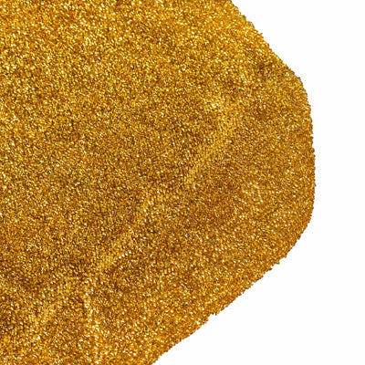 Golden glitter texture on a white background.