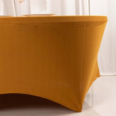 Yellow tablecloth draped over a table, showcasing its elegant shape and fabric texture.