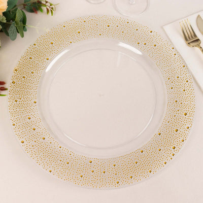 Clear plate with gold polka dot border on a neutral table setting.