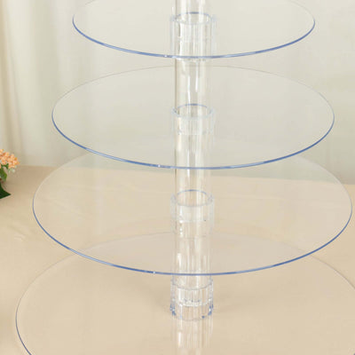 Acrylic tiered cake stand with transparent circular plates and central support.