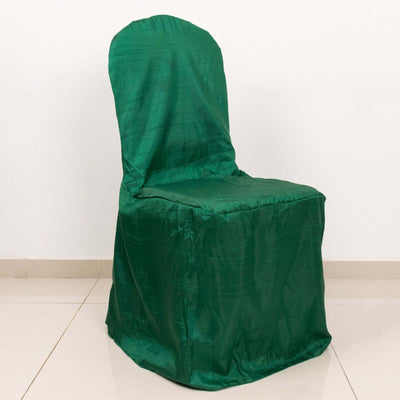 Green chair cover draped on a chair for events or decorations