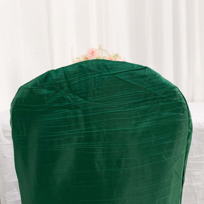 Green chair cover with a smooth texture on a plain white background.