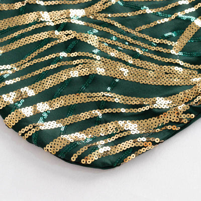 Green fabric with gold sequins in a wavy pattern.