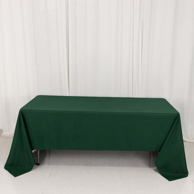 Green tablecloth draped elegantly over a table.