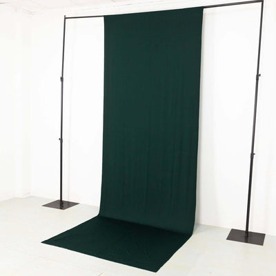 Green fabric backdrop for photography or staging purposes