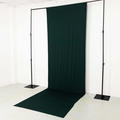 Green fabric backdrop on a studio stand for photography
