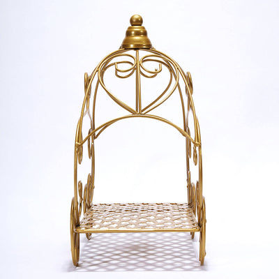 Gold decorative cart with intricate design and wheels