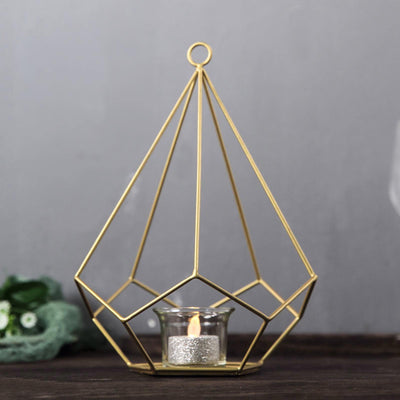 Gold geometric candle holder with glass votive, perfect for home decor.